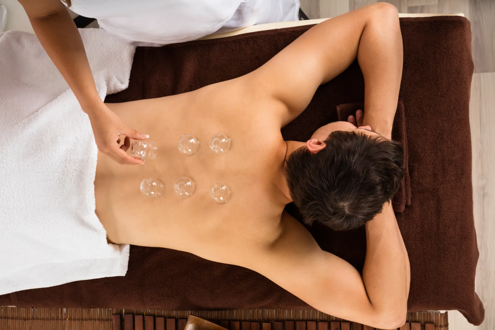 Man receiving cupping treatment